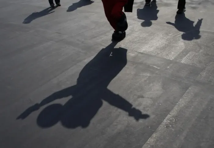 Framed Print : A shadow of Mickey Mouse is cast as the Disney character waves to visitors at Tokyo Framed Print : A shadow of Mickey Mouse is cast as the Disney character waves to visitors at Tokyo