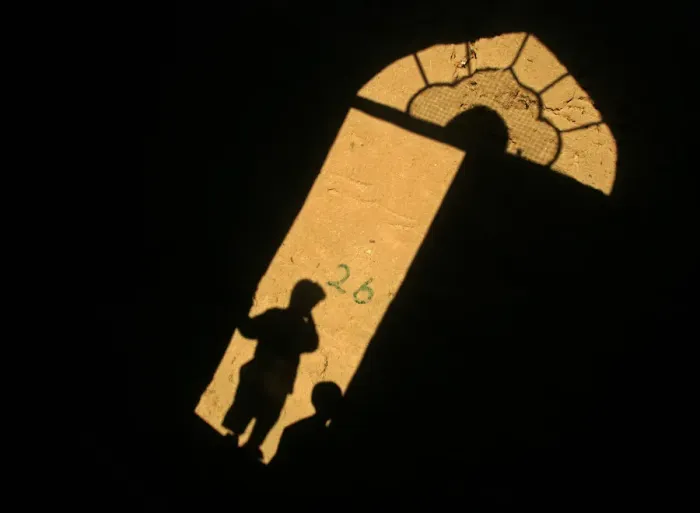 Framed Print : Shadows of Afghan children cast on a wall in the old city of Herat