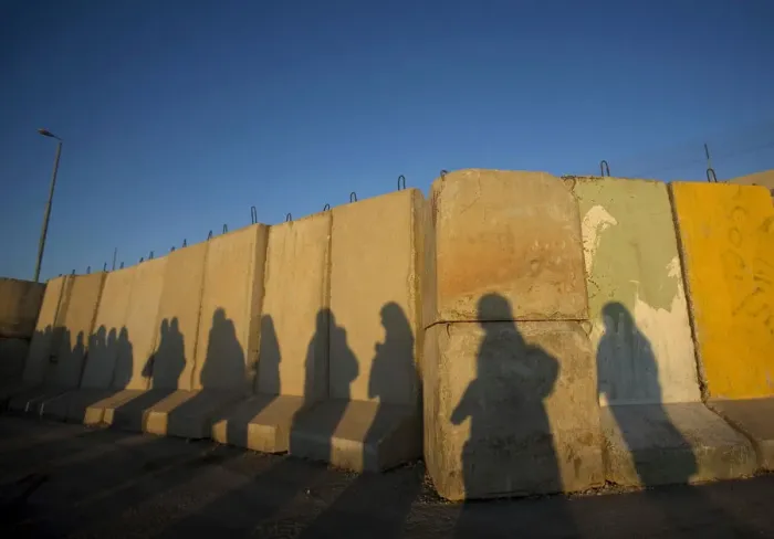 Framed Print : Shadows of Palestinian women are seen at Qalandiya checkpoint outside Ramallah Framed Print : Shadows of Palestinian women are seen at Qalandiya checkpoint outside Ramallah