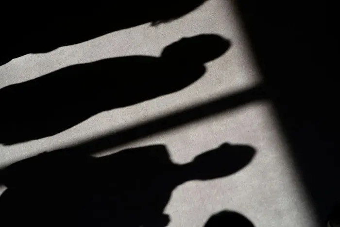 Framed Print : Shadows of people are cast on the carpet of the United Nations Security Council before
