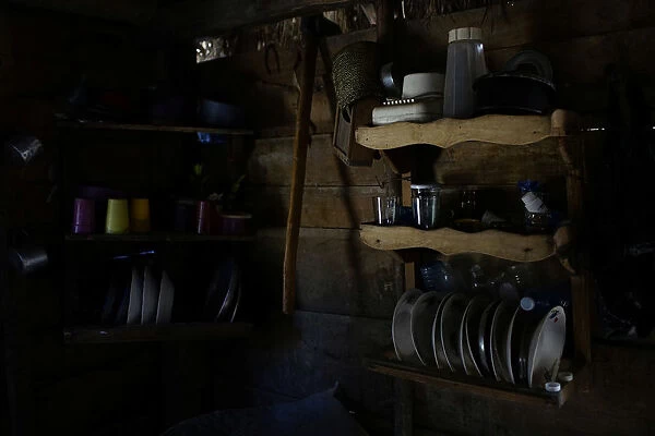Shelves filled with kitchenware hang in a house in the mountains near Santo Domingo, Cuba
