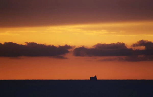 A ship is seen on the horizon of the Atlantic ocean, in Havana
