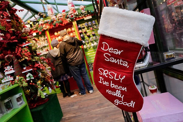 Shoppers buy Christmas stuff in the Manhattan borough of New York City, New York