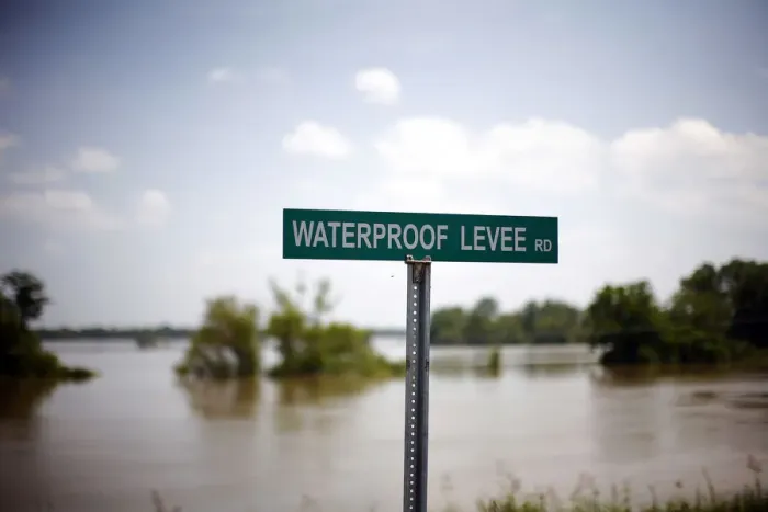 Framed Print : A sign is seen on a levee holding back the Mississippi River in Waterproof, Louisiana