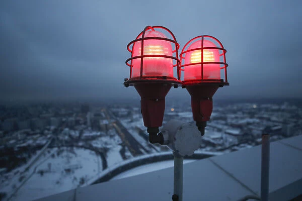 Signal lights are seen on the roof of a residential compound in Moscow