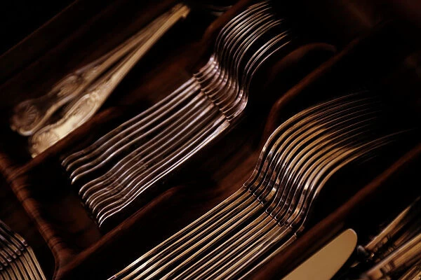 Silver cutlery is seen stored in a drawer at a private home in Valletta