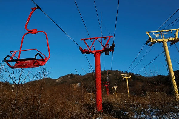 Ski lift chairs hang at the abandoned Alps Ski Resort located near the demilitarized zone