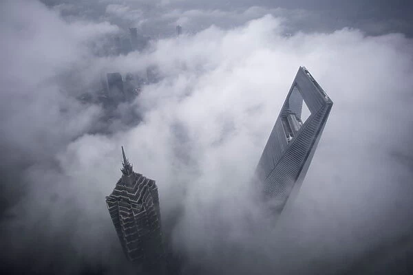 Skyscrapers Shanghai World Financial Center and Jin Mao Tower are seen during heavy