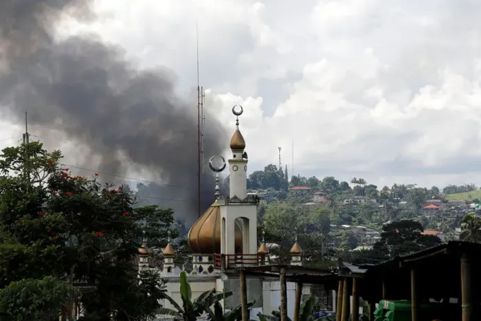 Framed Print : Smoke billows at the site of fighting between government soldiers and Maute group