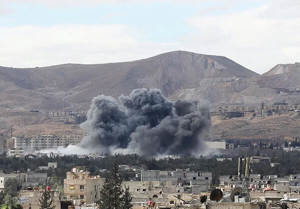 Smoke rises from the besieged Eastern Ghouta in Damascus