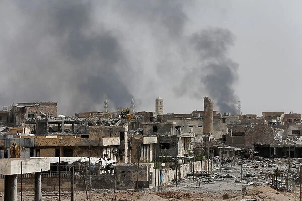 Smoke rises from clashes during the fight with the Islamic States militants in the Old