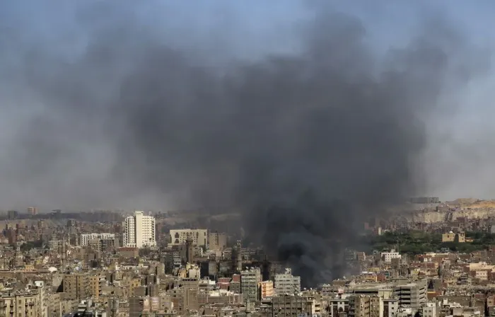 Framed Print : Smoke rises as a fire rages in central Cairo