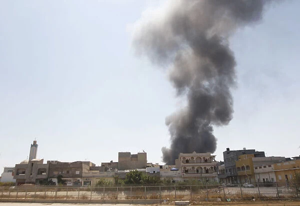 Smoke rises above following a fight at Souk Bouslim