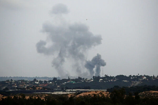Smoke rises following an Israeli air strike on the Gaza Strip as seen from the Israeli