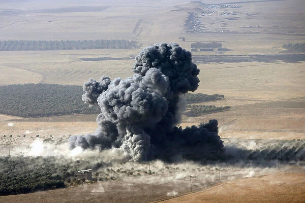 Smoke rises at Islamic State militants positions in the town of Naweran