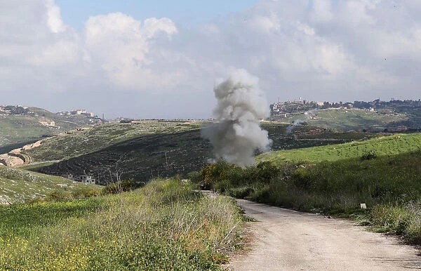 Smoke rises from the Israeli drone after it crashed in Beit Yahoun village