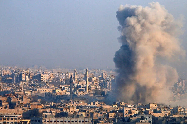Smoke rises as seen from a government-held area of Aleppo