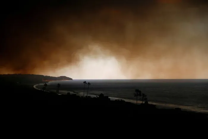 Framed Print : Smoke is seen over the ocean as the Woolsey Fire burns in Malibu
