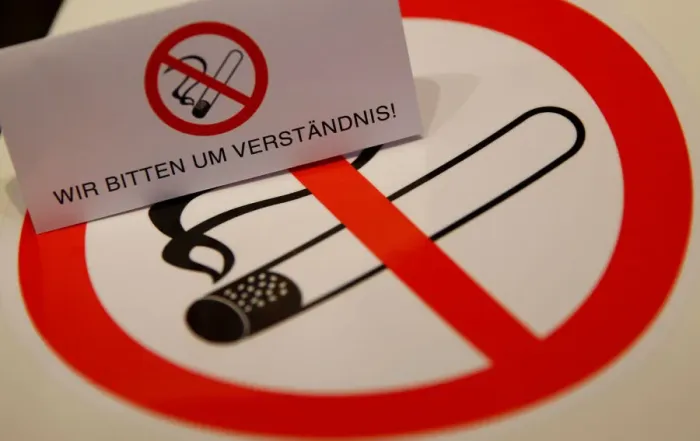Framed Print : No smoking signs are seen on a table in a sign shop in Vienna Framed Print : No smoking signs are seen on a table in a sign shop in Vienna