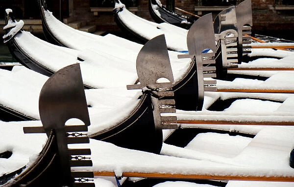 Snow covered gondolas are seen near St. Marks square in Venice