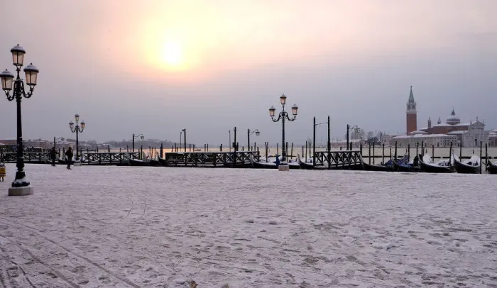 Framed Print : Snow covered gondolas are seen near St. Marks square in Venice lagoon Framed Print : Snow covered gondolas are seen near St. Marks square in Venice lagoon