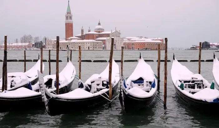 Framed Print : Snow covered gondolas are seen near St. Marks square in Venice Framed Print : Snow covered gondolas are seen near St. Marks square in Venice