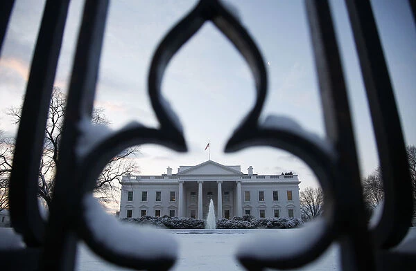 Snow covers the grounds of the White House in Washington