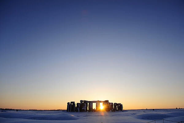Snow covers the plains surrounding Stonehenge in Wiltshire, southern England