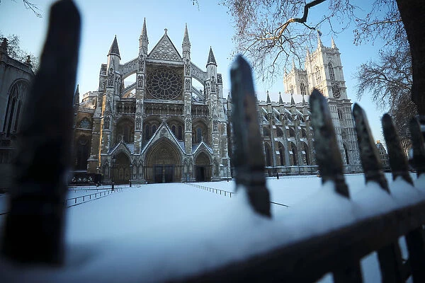 Snow covers the railings outside Westminster Abbey, London