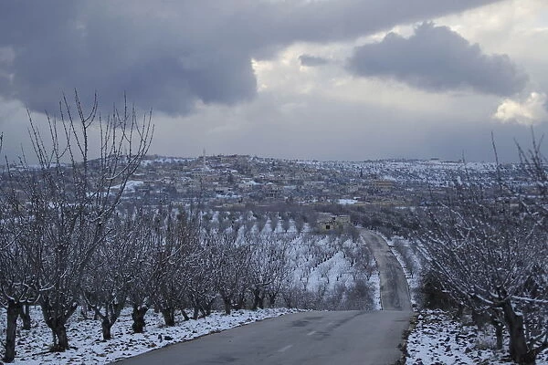 Snow covers a village in Jabal al-Zawiya, in the southern countryside of Idlib, Syria