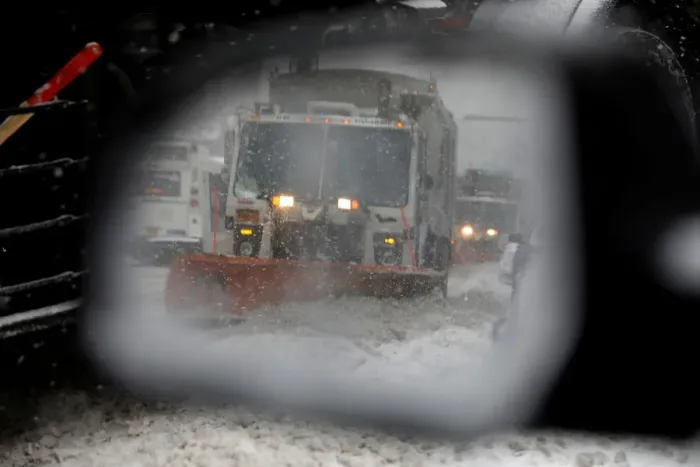 Framed Print : A snowplow is seen in a cars side mirror in upper Manhattan during Storm Grayson in New Framed Print : A snowplow is seen in a cars side mirror in upper Manhattan during Storm Grayson in New