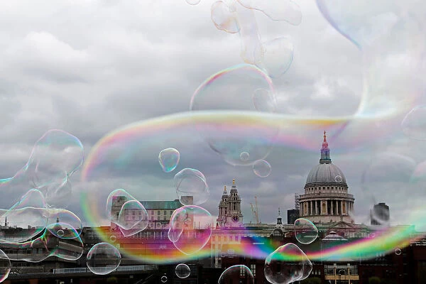 Soap bubbles float past St Pauls Cathedral in central London