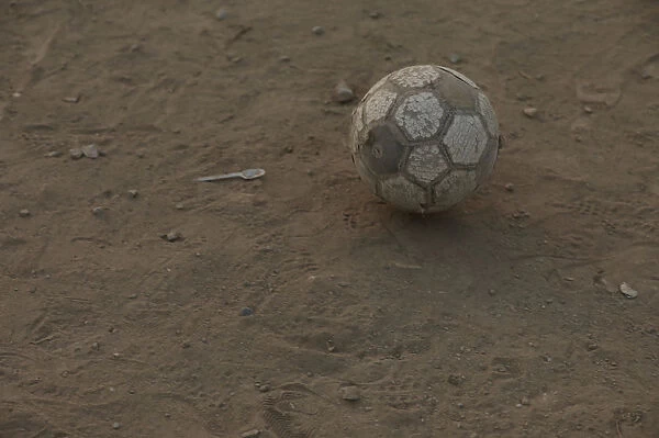 A soccer ball is seen during a game at a makeshift soccer pitch in Nueva Union shantytown