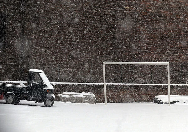 Soccer goalpost is seen during a snowstorm in Milan