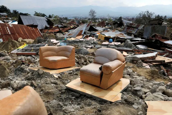 Framed Print : A sofa is seen among the ruins of a house after an earthquake hit Balaroa sub-district in Framed Print : A sofa is seen among the ruins of a house after an earthquake hit Balaroa sub-district in
