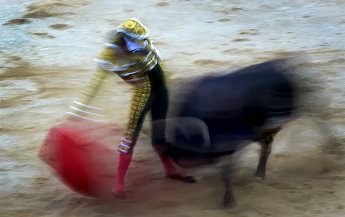 Framed Print : Spanish bullfighter Pepe Moral performs a pass during a bullfight at the San Fermin Framed Print : Spanish bullfighter Pepe Moral performs a pass during a bullfight at the San Fermin