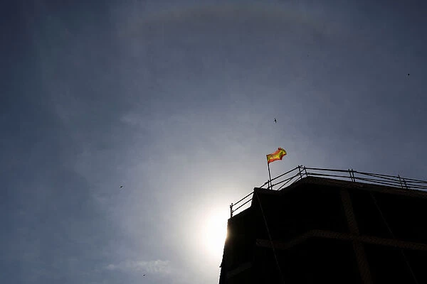 A Spanish flag is seen on top of an apartment building under construction in Madrid