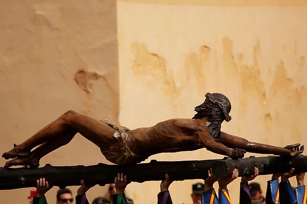 Spanish legionnaires carry statue of Christ of Mena during Holy Week, in Malaga