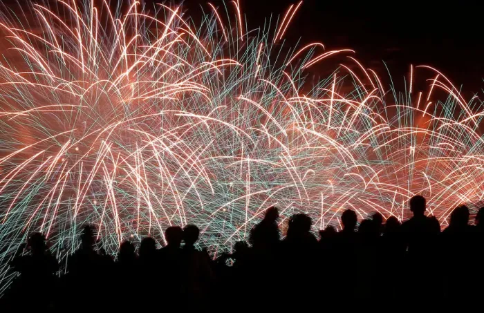 Framed Print : Spectators watch as fireworks explode in the sky as part of celebrations for Victory Day Framed Print : Spectators watch as fireworks explode in the sky as part of celebrations for Victory Day