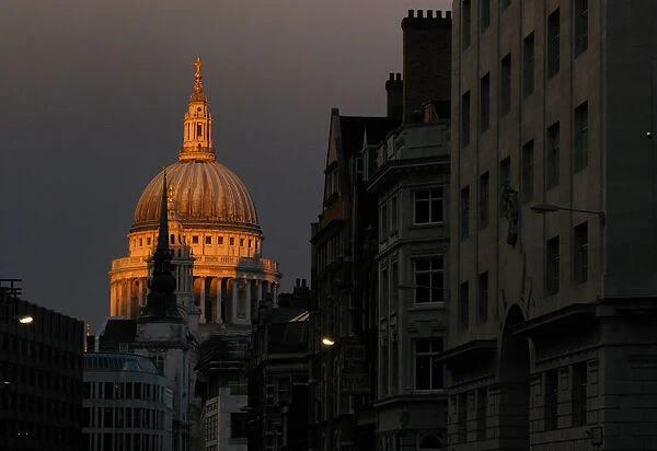 St Pauls Cathedral is seen at dusk beyond Fleet Street in central London