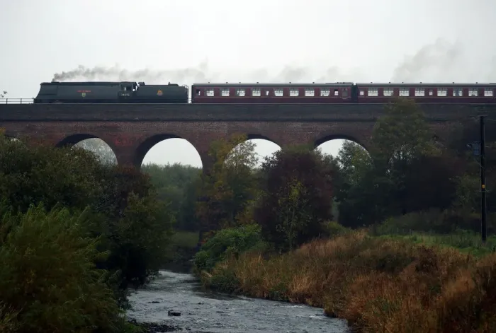 Framed Print : A steam train travels along the East Lancashire Railways line near over Roch Valley