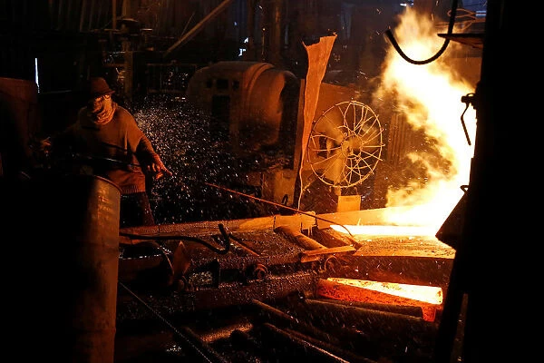 A steelworker is seen in a mill in Chau Khe village outside Hanoi