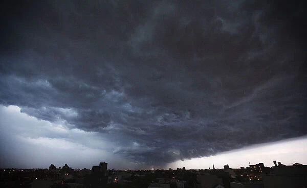 A storm cloud begins to dump rain as it passes over the Brooklyn borough of New York