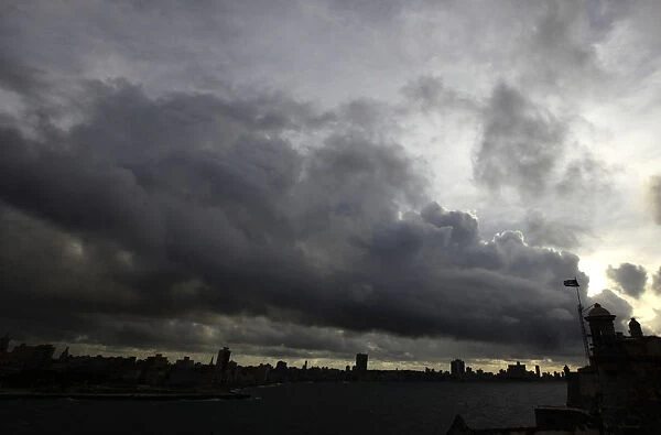 Storm clouds are seen over the skyline of Havana