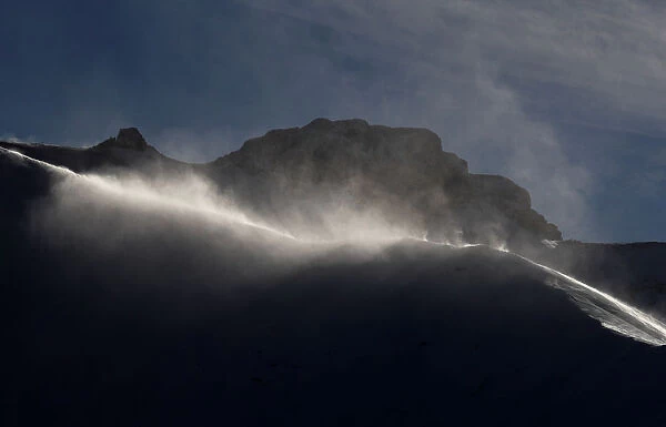 Strong winds blow snow on a ridge in Adelboden