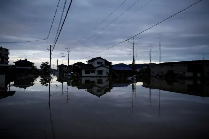 Framed Print : Submerged houses are seen in a flooded area in Mabi town in Kurashiki Framed Print : Submerged houses are seen in a flooded area in Mabi town in Kurashiki