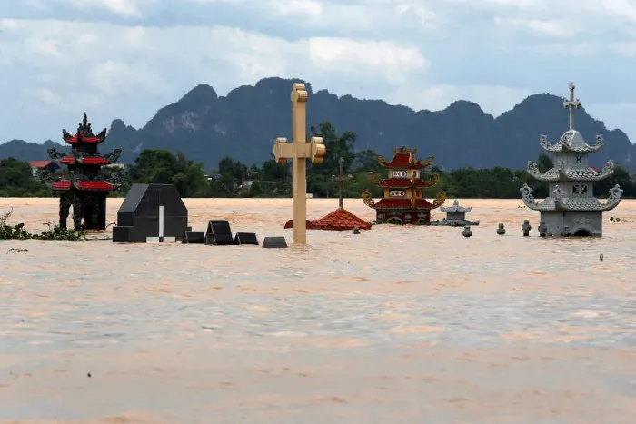 Framed Print : Submerged tombs are seen at a flooded village after heavy rainfall in Ninh Binh province Framed Print : Submerged tombs are seen at a flooded village after heavy rainfall in Ninh Binh province