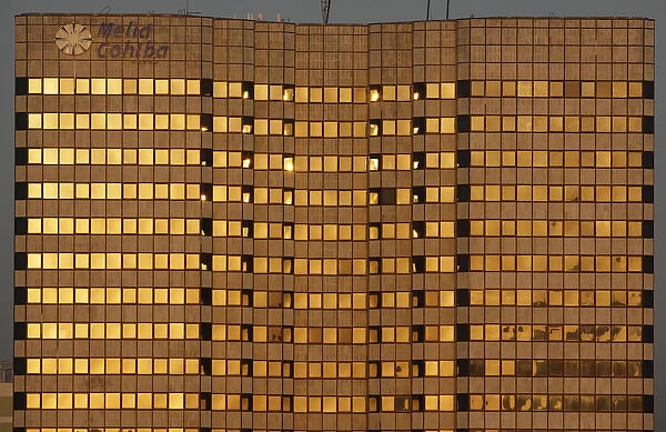 The sun at dawn shines on Havanas five-star Hotel Melia Cohiba