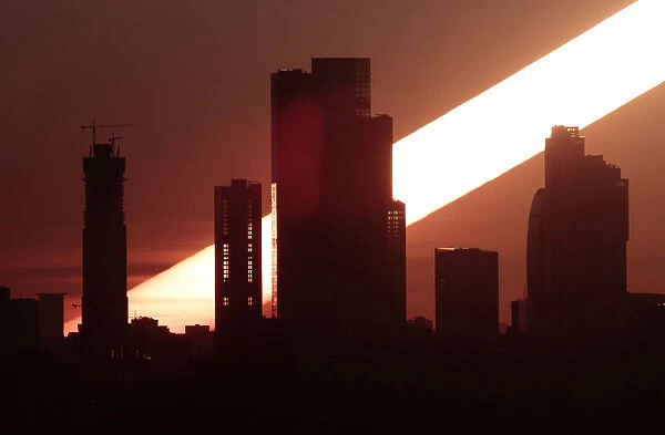 The sun rises behind the skyscrapers of the Moscow International Business Centre in