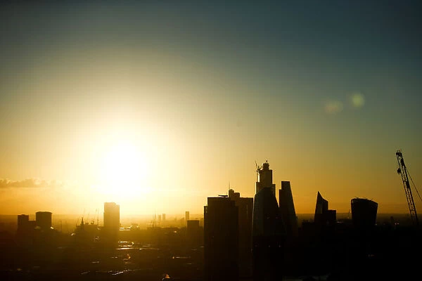 The sun rises during the Summer Solstice, seen from atop the London Eye, in London